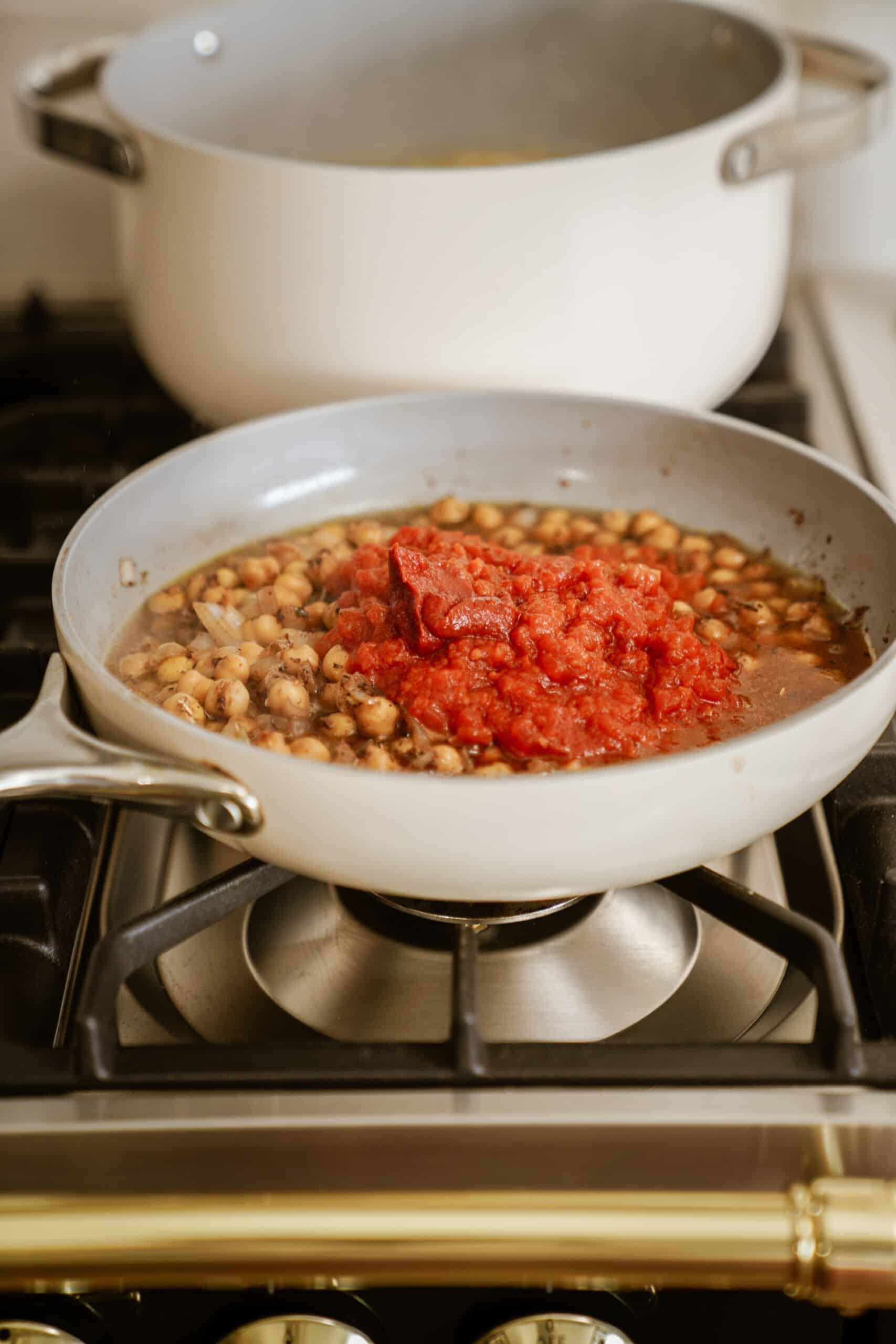 Chickpeas and tomato sauce cooking in a pan