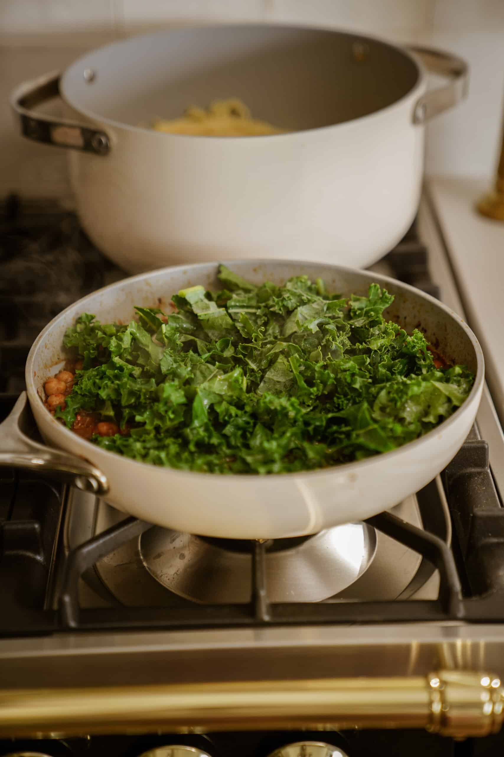 Green kale cooking in a pan