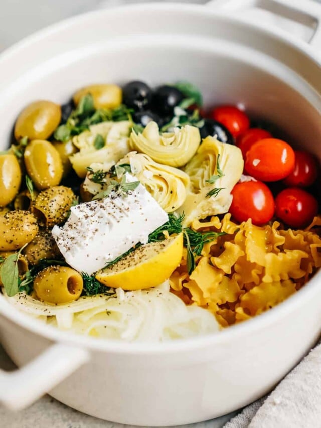 Close-up of a big pot with all the ingredients for a one pot greek pasta. One of my favorite, easy, vegan meals.