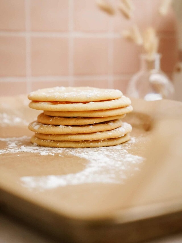 Stack of holiday sugar cookies on a surface