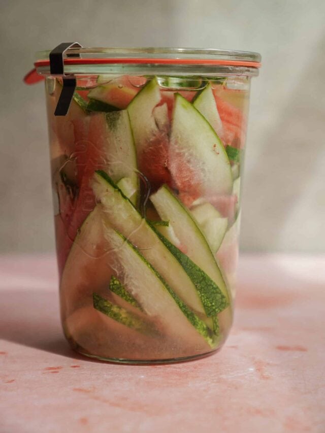 Close-up of pickled watermelon rind in a jar