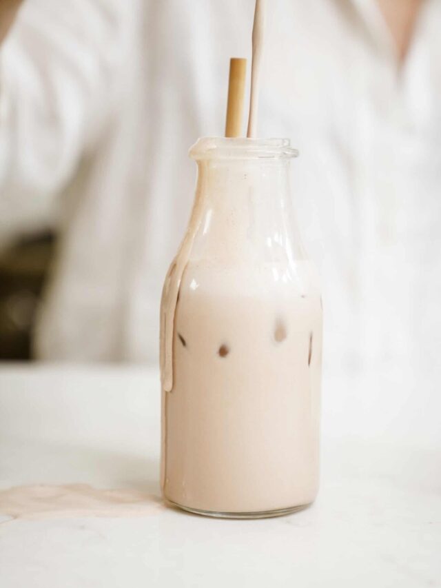 Barista oat milk in a jug on a countertop.