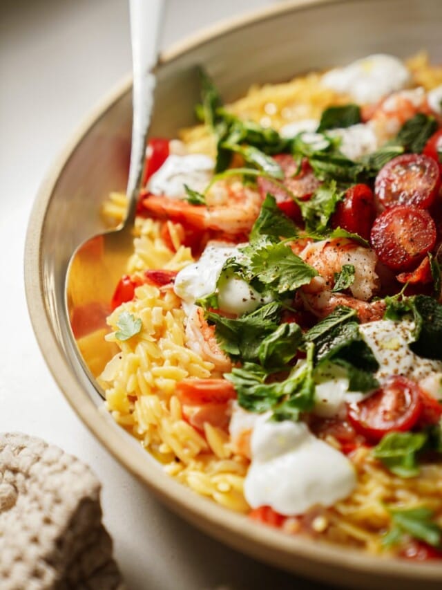 One pot orzo close up with a spoon in it