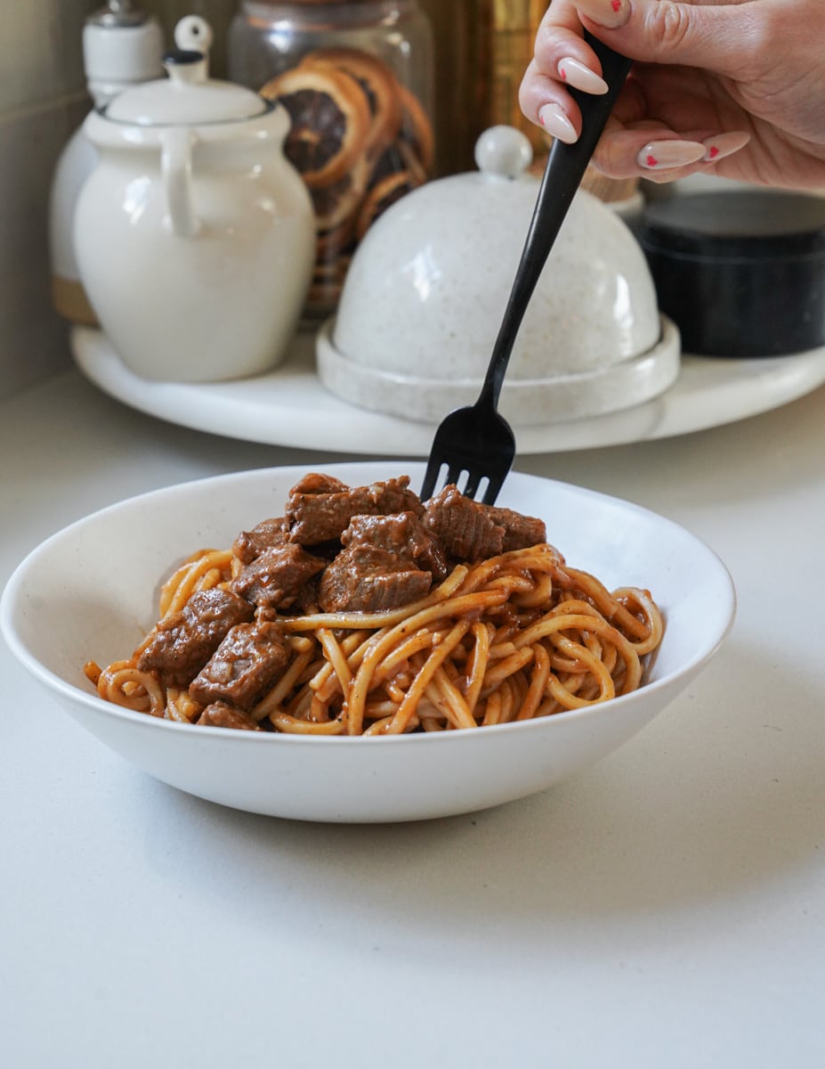 Easy Beef Stew in a bowl with noodles