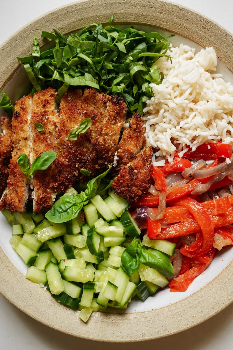 Fried Chicken Cutlets in a bowl with veggies