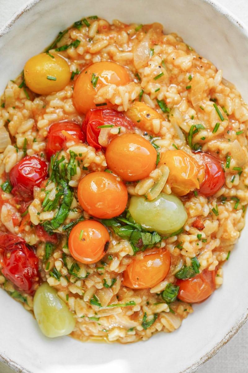 Blistered tomato in bowl with orzo