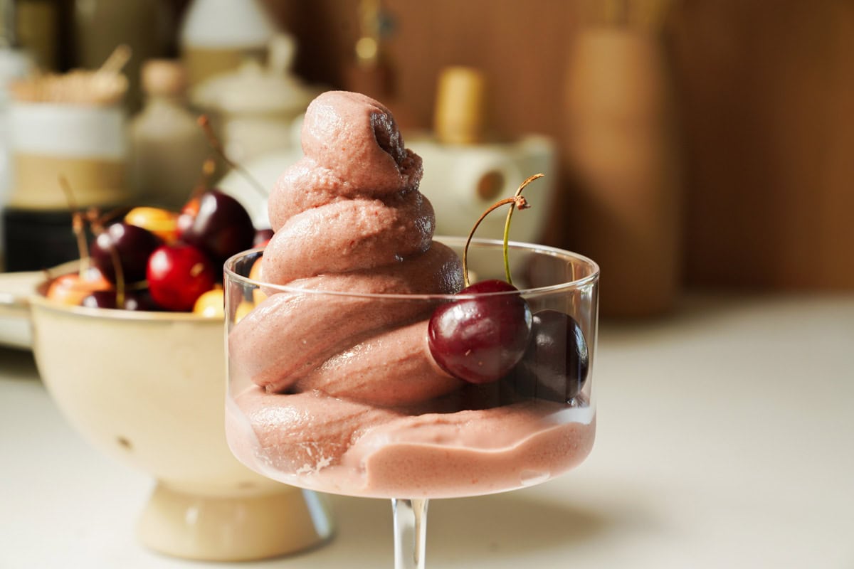 Cherry Frozen Yogurt Recipe in a cup with fresh cherries