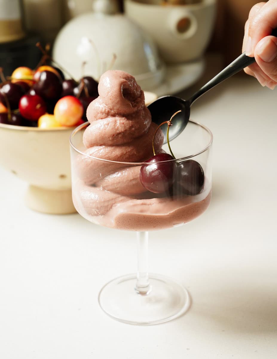 Cherry Frozen Yogurt Recipe in a cup with fresh cherries