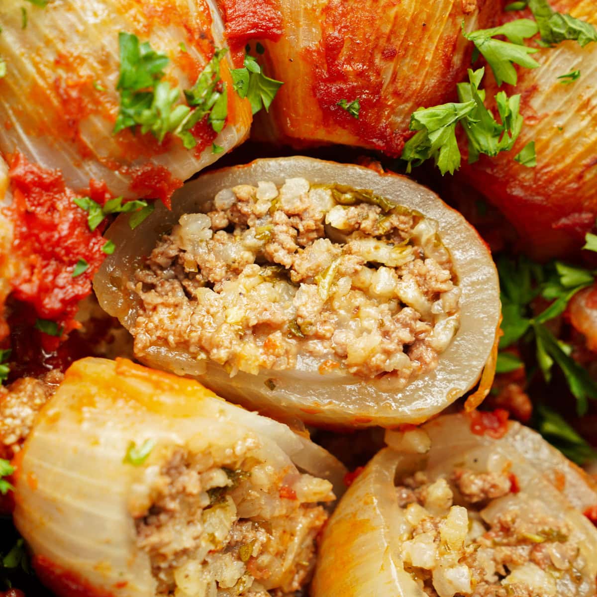 Cut open stuffed onions with rice filling