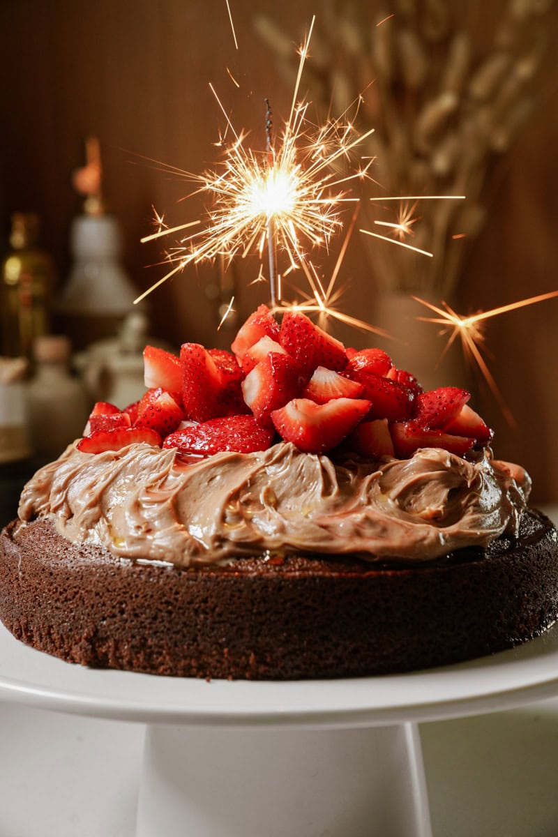 Chocolate olive oil cake with strawberries on top 