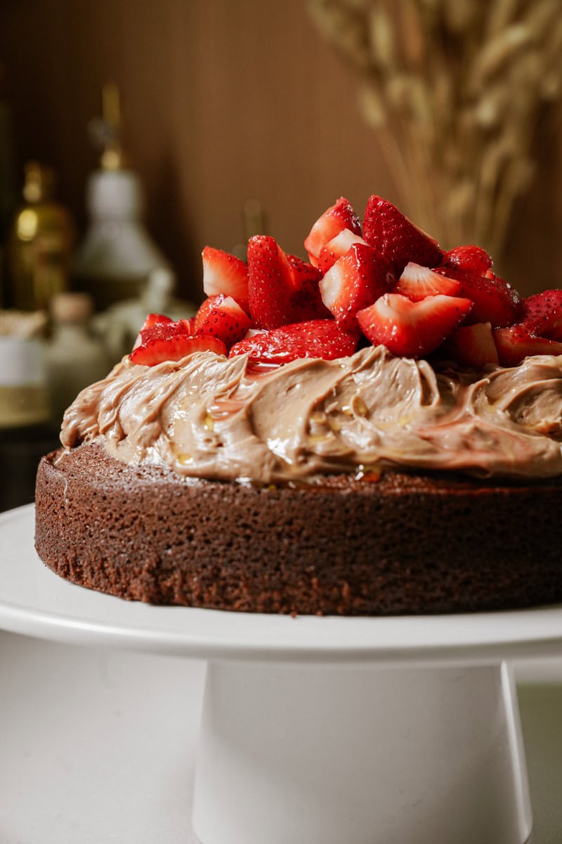 Chocolate olive oil cake with strawberries on top 