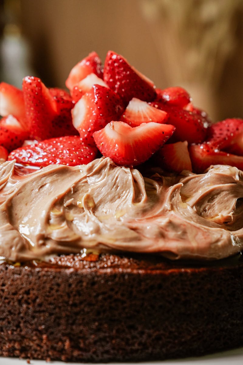 Chocolate olive oil cake with strawberries on top 