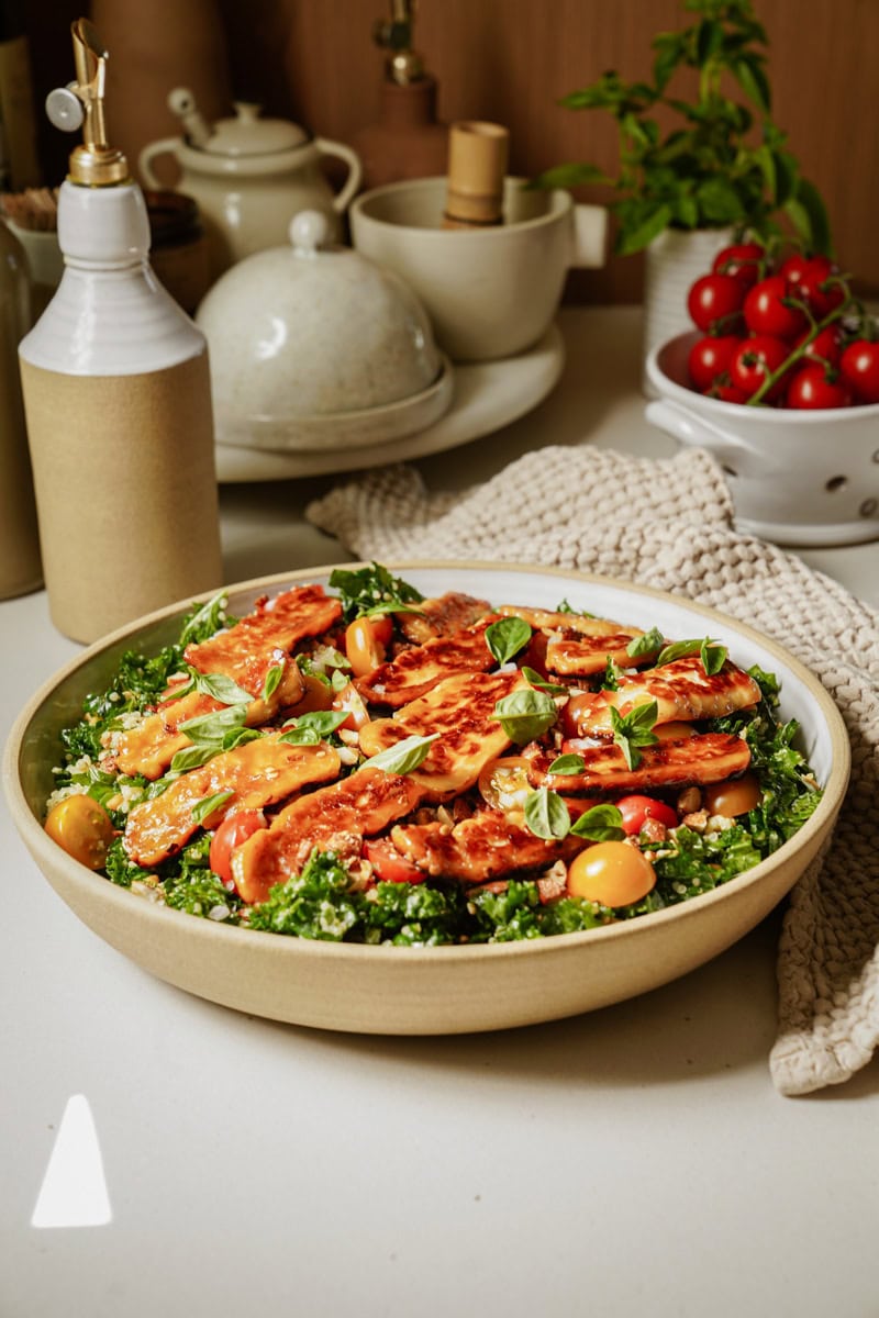 Halloumi salad in a big white bowl on a counter