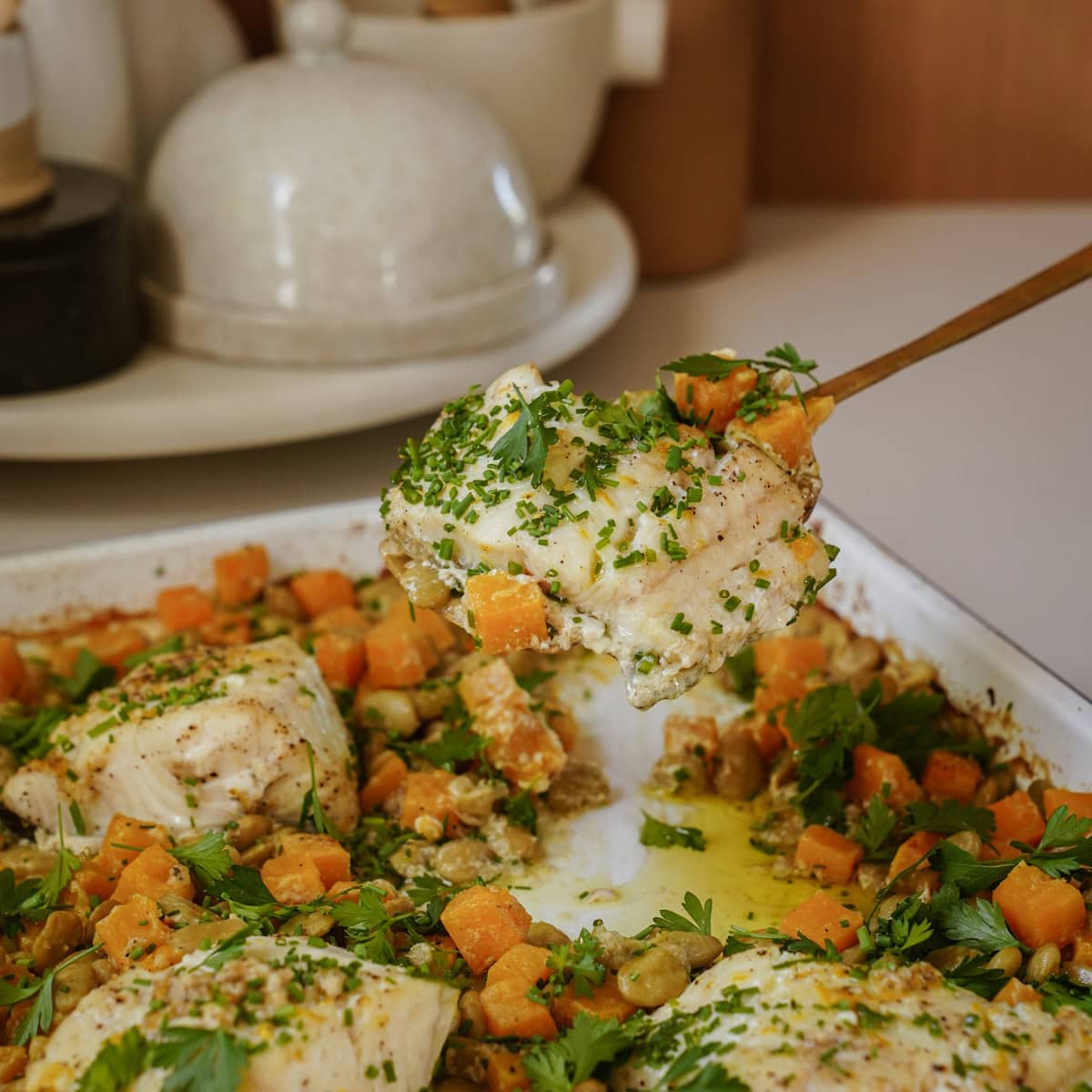 Cod being scooped off baking tray