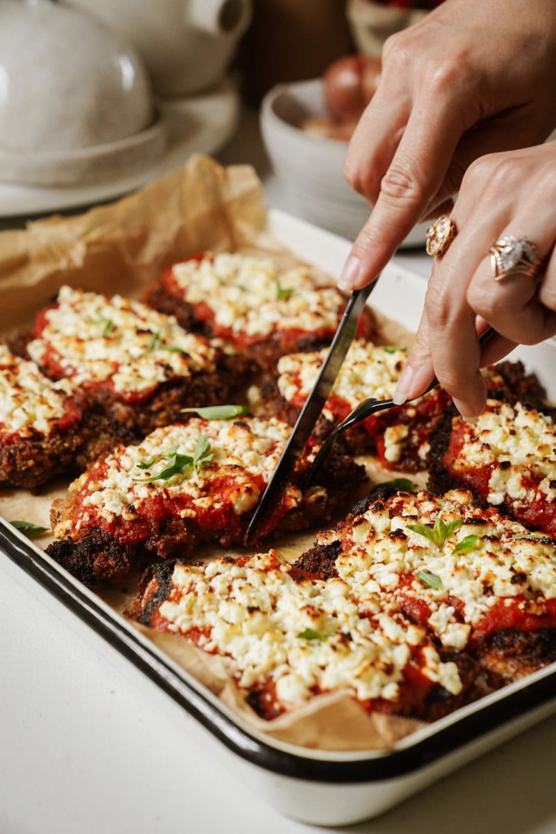 Chicken parmesan with feta on baking tray